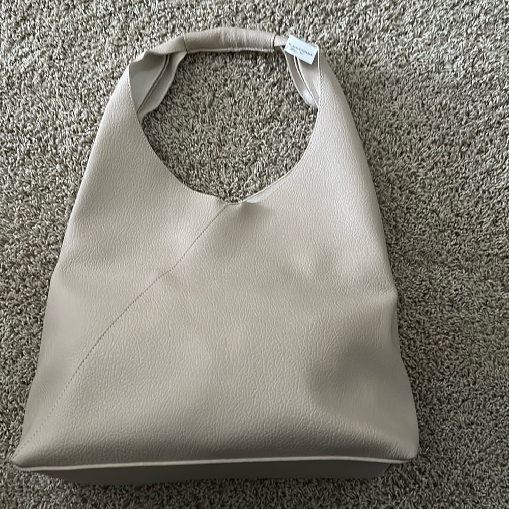 Vegan leather slouchy tote. Bone in color. New with tag.